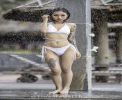 u/tinymodelthuy getting wet in her white bikini with cameltoe from bikini volleyball cameltoe