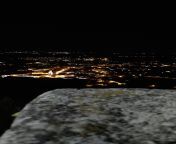 low quality night picture of my city that i took from a mountain after being chased by a wild boar in a street with no lights rule from boar raped