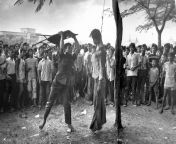 [History] Royalist crowd looks on as a man uses a folding chair to beat the hung body of leftist student Wichitchai Amornkul just outside Thammasat University. Bangkok, Thailand. October 6, 1976. from indonesian student tarra nadhira hindersah leaked nude university scandal