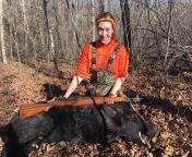 My oldest daughter with boar she took using my Garand. from boar raped