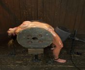 BDSM Girl Tied up very roughly on a wheel from premmiumhentai bdsm