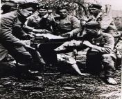 Ustae (Independent State of Croatia during World War 2) soldiers beheading ethnic Serb Branko Jungi? with a saw. Photographed near Bosanska Gradika between 1941 - 1945 from nude beheading