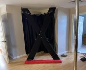 St. Andrews Cross or X-cross homemade foam padding wrapped with material. Self standing with chain on bottom from bastienne cross