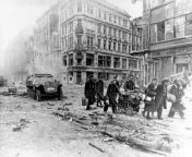 Street scene at the end of the war in Berlin 1945 - Refugees return to the ruined city and make their way through the rubble and corpses after the surrender in May 1945. from 1945 sexks