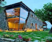 Amazing glassed corner of a two story stone house! from it house