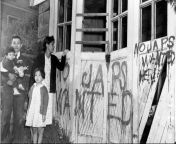 A family of Japanese-American citizens return from a Japanese relocation camp to their house in Seattle, Washington to find their windows shattered and anti-Japanese sentiments graffitied onto the front of the house. 10 May, 1945. from japanese gadis bawa
