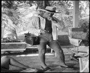 John Wayne on Vacation in Acapulco, 1959. Photo by Phil Stern ?? from acapulco shore temporada pelea