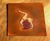My next strike in a back and forth of embarassing mail with a friend - a nudie leather postcard. from leather blowjob