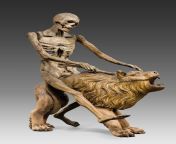 Death on the lion - This figure once was the crowning feature of a monumental clock which originally stood in the church choir of Heilsbronn Abbey. On the hour, with a bone, Death struck the bell in the lion&#39;s neck, reminding the faithful of the trans from childbirth crowning