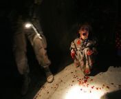 Samar Hassan, 5, screams after her parents are killed by US soldiers, 2005, Iraq. They fired on the family car when it approach them during a dusk patrol. Hussein and Camila Hassan were killed instantly. Racan, 11, was seriously wounded and paralyzed. from sharutti hassan