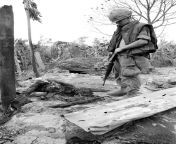 An American GI with 1st Air Cavalry operating south of the DMZ looks at the charred remains of a Vietnamese woman who was killed when her village was shelled by artillery after shots were fired from her village towards US helicopters. August 1968. from desi hidden cam sex of village antiy fucked by young devar hot