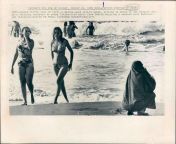 TWO WAYS OF LIFE - A middle-aged veiled woman, sitting on beach of the Caspian Sea, is a striking contrast to young bikini-clad girls from Tehran enjoying a weekend near Babolsar. (AP Wirephot &#124; SECOND OF THREE PICTURES) - August 23, 1971 [720 x 583] from ﺳﻜﺲxxvediw ﺤﺠﺒﺎﺕ ﺻﻮﺭ ﺳﻜﺲ ﺤﺠﺒﺎﺕ sex veiled ﺍﻷ‌ﺭﺷﻴﻒ ﻨﺘﺪﻳﺎﺕ ﺳﻜﺴﻰ exy resmaan college girl unjab gay boys hot sex tube