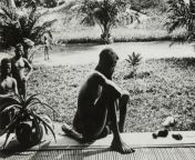 A slave looks at a hand and foot that was chopped off his 5yr old daughter during the &#39;rubber boom&#39;, Congo, Africa. 1904, photo from Anti-Slavery International. from 5yr gril saxy vadeo