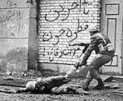 An Iranian soldier pulling his wounded friend out of the street, during the First Battle of Khorramshahr. Iran-Iraq War, October 1980 from mehran iranian