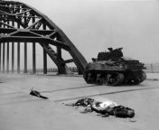 M4 Sherman tank drives past the body of a German soldier on the Nijmegan bridge; Operation Market Garden, September 1944 from garden of sinners german dub