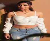 Payal Rajput navel in white top and blue jeans from payal koyal