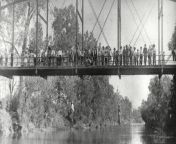 The bodies of Laura Nelson and her 14 year old son L.D. hang from a bridge after being lynched by the town folk of Okemah, Oklahoma. 25 May 1911. from 14 yars arab son