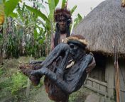 Chief Eli Mabel of the Dani tribe in Papua, Indonesia, holding the mummified remains of his ancestor Agat Mamete Mabel, who the tribe members claim he ruled approximately 250 years ago [1024x681]. from indonesia puput novel bgil