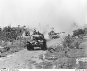 Vietnam War. January 1970. Centurion Mk V/1 tanks of the Australian Army&#39;s A Squadron, 1st Armoured Regiment, rumble along Route 23 headed for Binh Tuy Province during Operation Matilda. A Centurion Armoured Recovery Vehicle (ARV) is bringing up the r from tamil arv