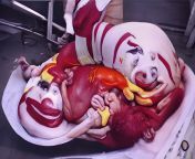 Ronald McDonald giving birth to a pig that is giving birth to Ronald McDonald from giving birth vaginal birth