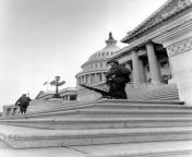 Soldier stands besides his M60 machine gun, which is mounted on the steps of the U.S. Capitol to deter rioters from entering the building during the Martin Luther King Jr. assassination riots in Washington D.C. (April 1968) [800 x 1157] from jr nudits