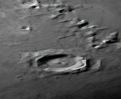 Close up of a crater and some mountains from a composite of the moon I did. If it gives off it&#39;s own light why are there shadows from the mountains and craters? from milk close up of a mouthful