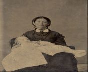 Post-mortem photograph of mother with her child. from girl post mortem s