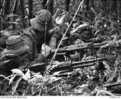 Vietnam War. Phuoc Tuy Province. 11 December 1969. During Operation Atherton, three soldiers of 1st Platoon, A Company, 8th Battalion, Royal Australian Regiment (8RAR), lie in an ambush position as the platoon stops in preparation for the night. (640 x 44 from derpixon preparation