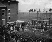 The crowd watches on as Mary Surratt (left), Lewis Powell, David Herold and George Atzerodt (Lincoln Co-Conspirators) hang from the gallows at the Old Arsenal Penitentiary. Photograph by Alexander Gardner. July 7, 1865 [1210x951] from wwe 2015 july 7 match photos