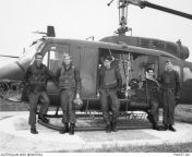Nui Dat, Phuoc Tuy Province. c August - October 1971. The crew of a No. 9 Squadron, RAAF, UH-1 Iroquois Medical Evacuation Team (Medevac), pose for a photo after completing another mission. from nui nui milkoo