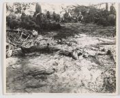 Marines rest next to the body of a fellow Marine as well as the body of a dead Japanese soldier. Battle of Tarawa. 20-23 November 1943 from 1234 the