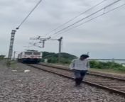 Indian versus train whilst filming for TikTok from indian railway train race