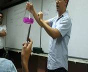 Sodium in water demonstrated with no protection by chemistry teacher at University of Costa Rica from yoga demonstrated with young girl